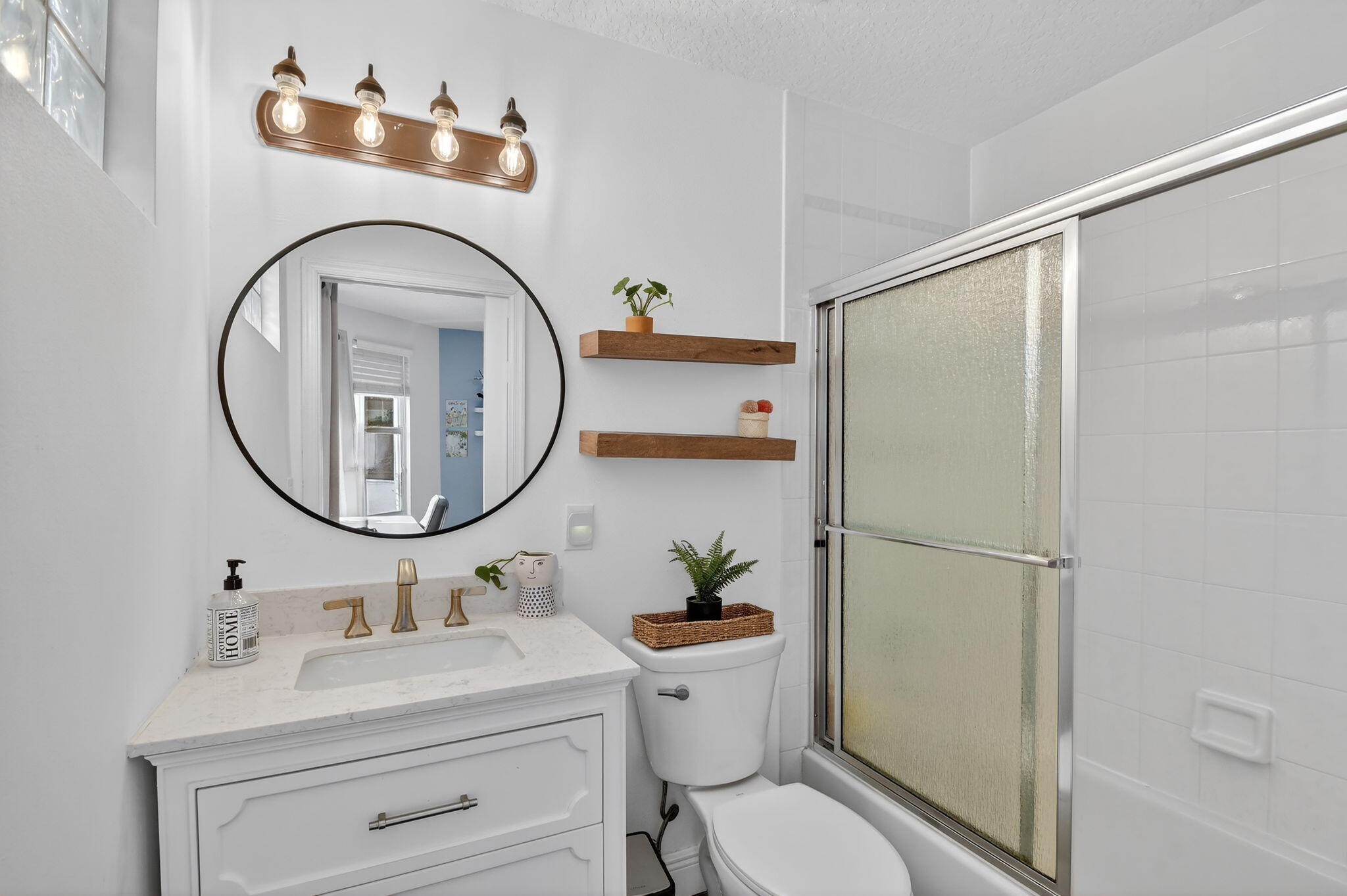 2769 Pointe Circle Greenacres, FL 33413 - Photo 27 of 48 a bathroom with a sink mirror toilet and shower