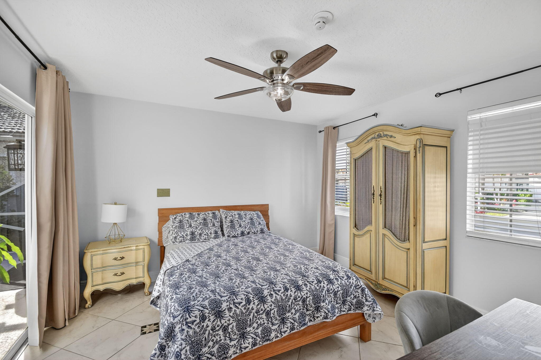 2769 Pointe Circle Greenacres, FL 33413 - Photo 28 of 48 a bedroom with a bed and wooden floor