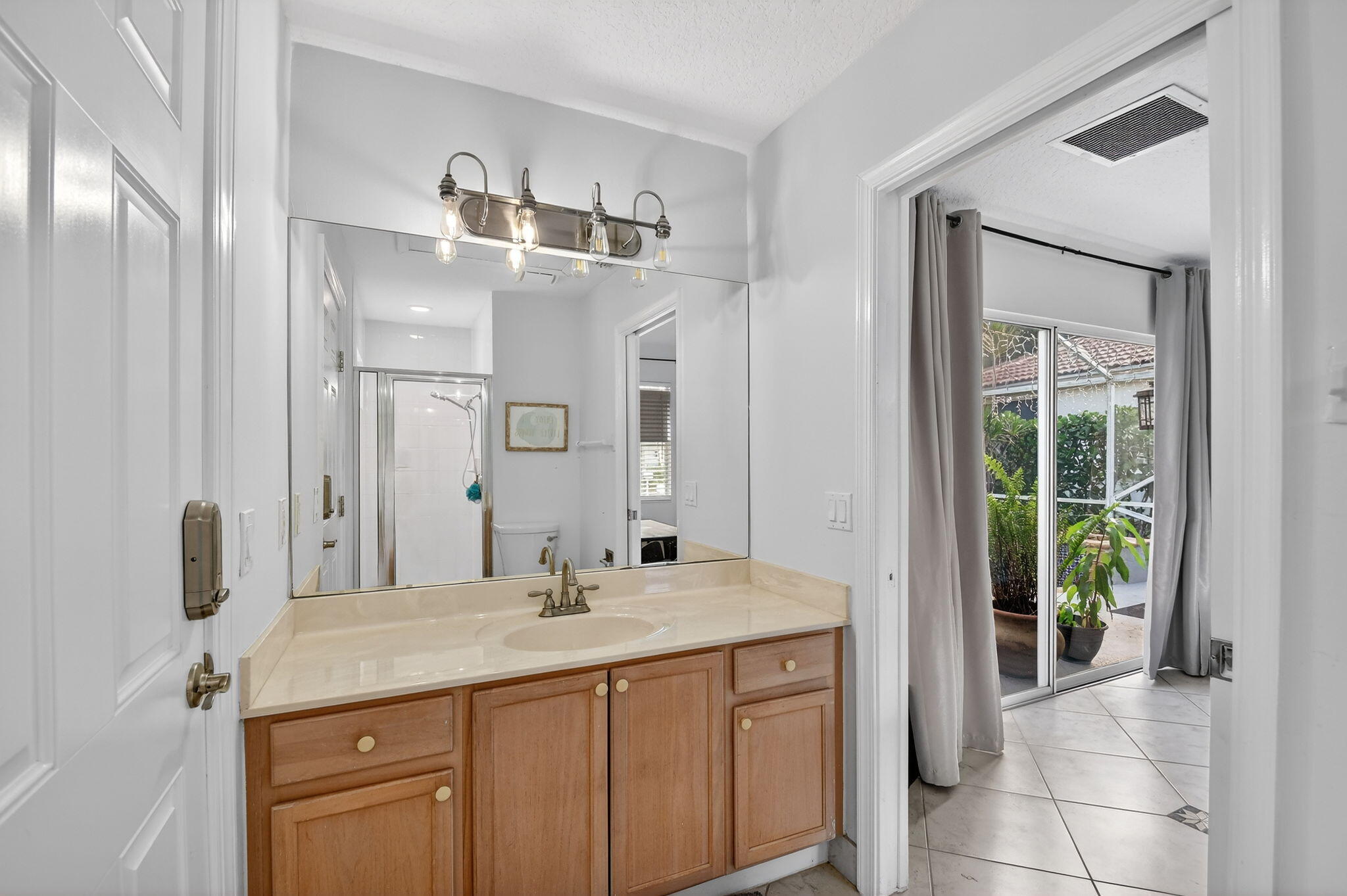 2769 Pointe Circle Greenacres, FL 33413 - Photo 29 of 48 a bathroom with a sink and a mirror