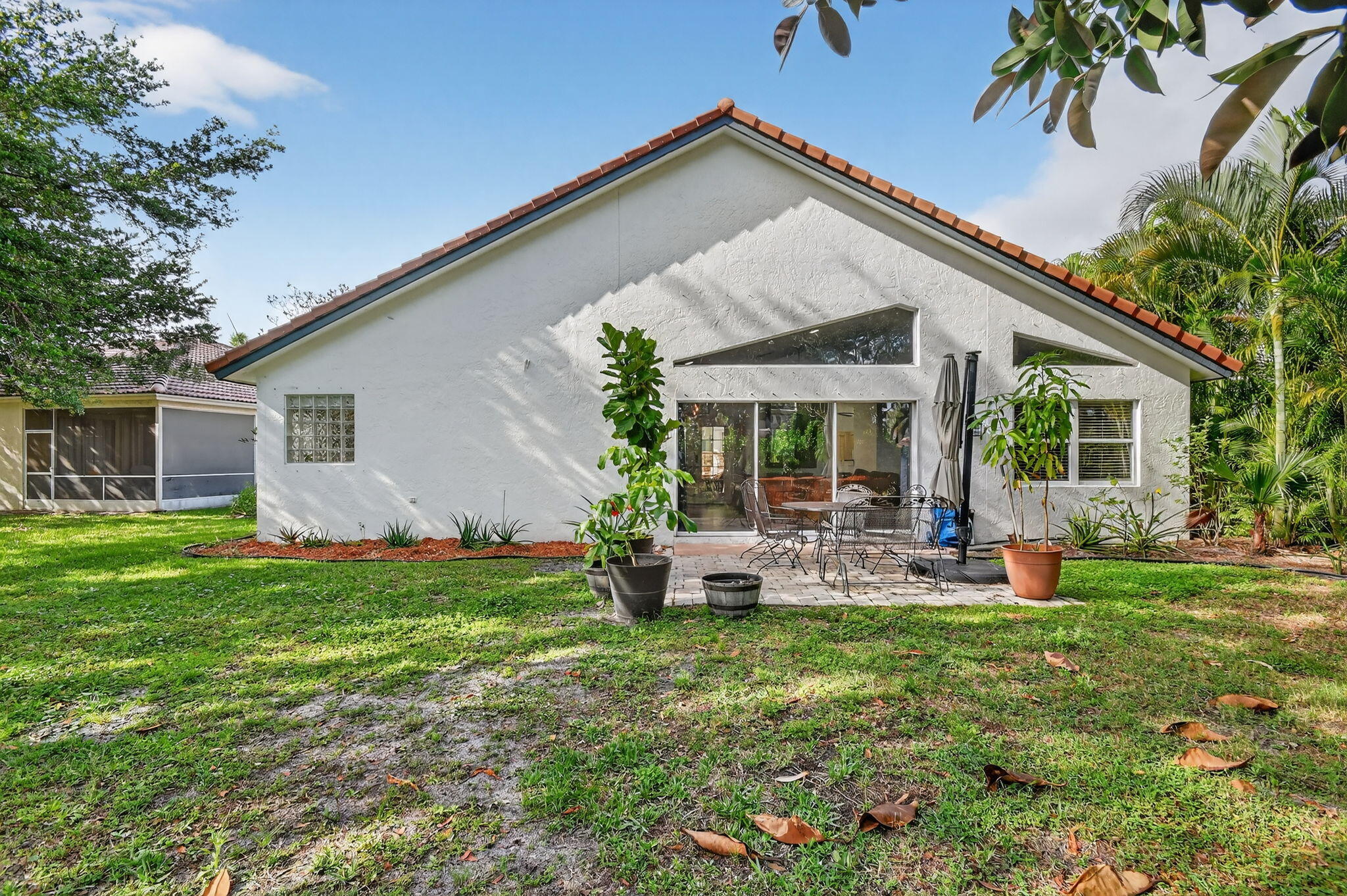 2769 Pointe Circle Greenacres, FL 33413 - Photo 35 of 48 a front view of house with yard and outdoor seating