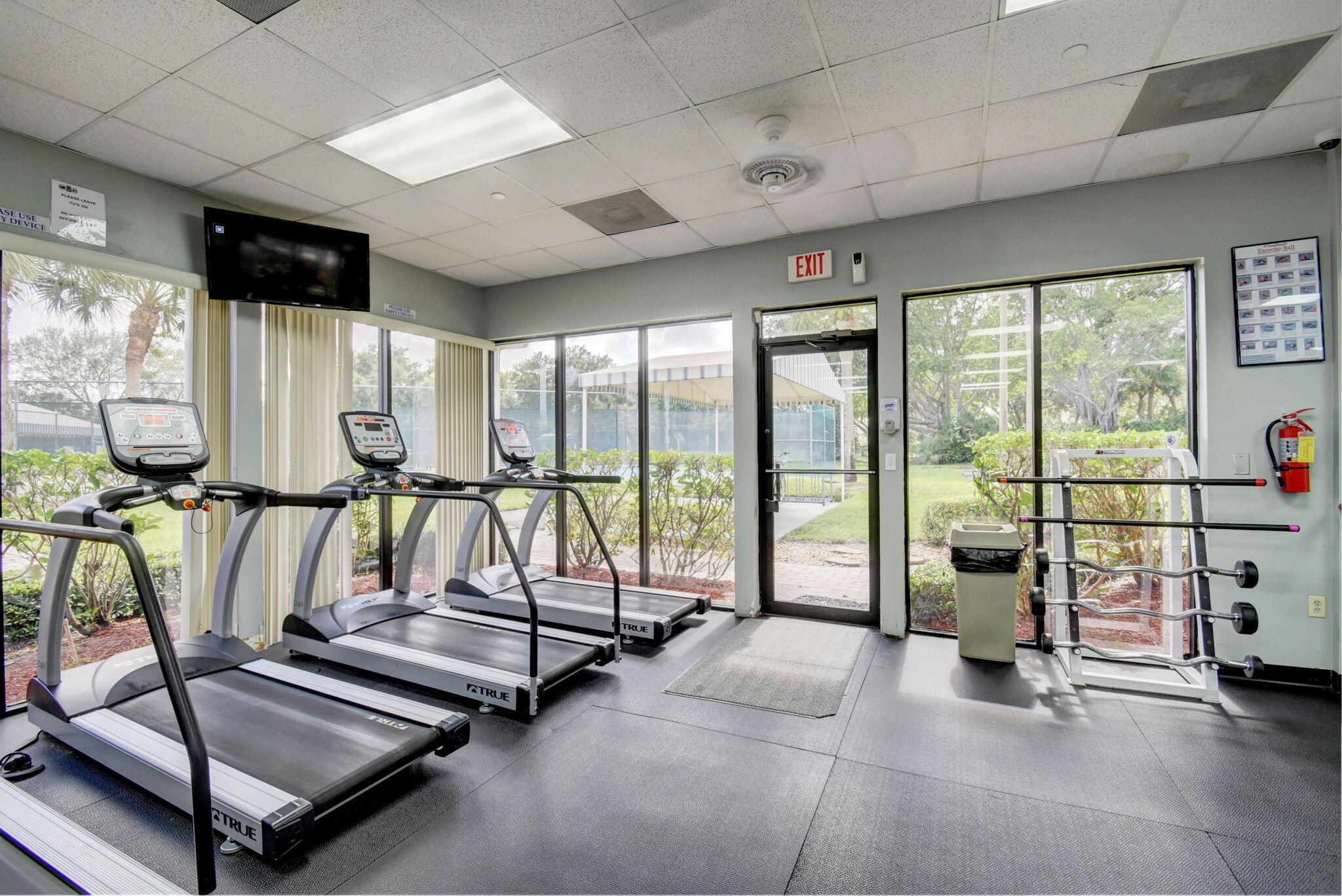 2769 Pointe Circle Greenacres, FL 33413 - Photo 40 of 48 a view of a room with gym equipment