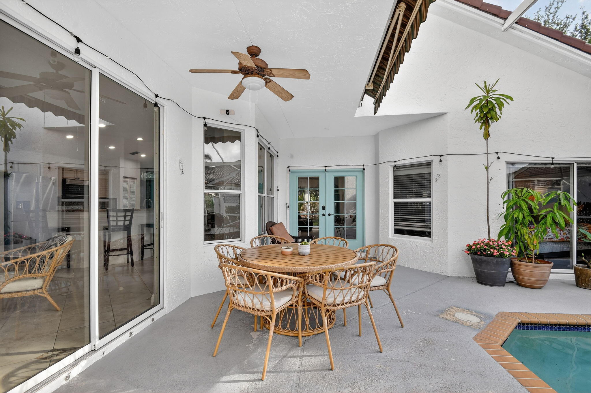 2769 Pointe Circle Greenacres, FL 33413 - Photo 4 of 48 a dining room with furniture potted plants and wooden floor