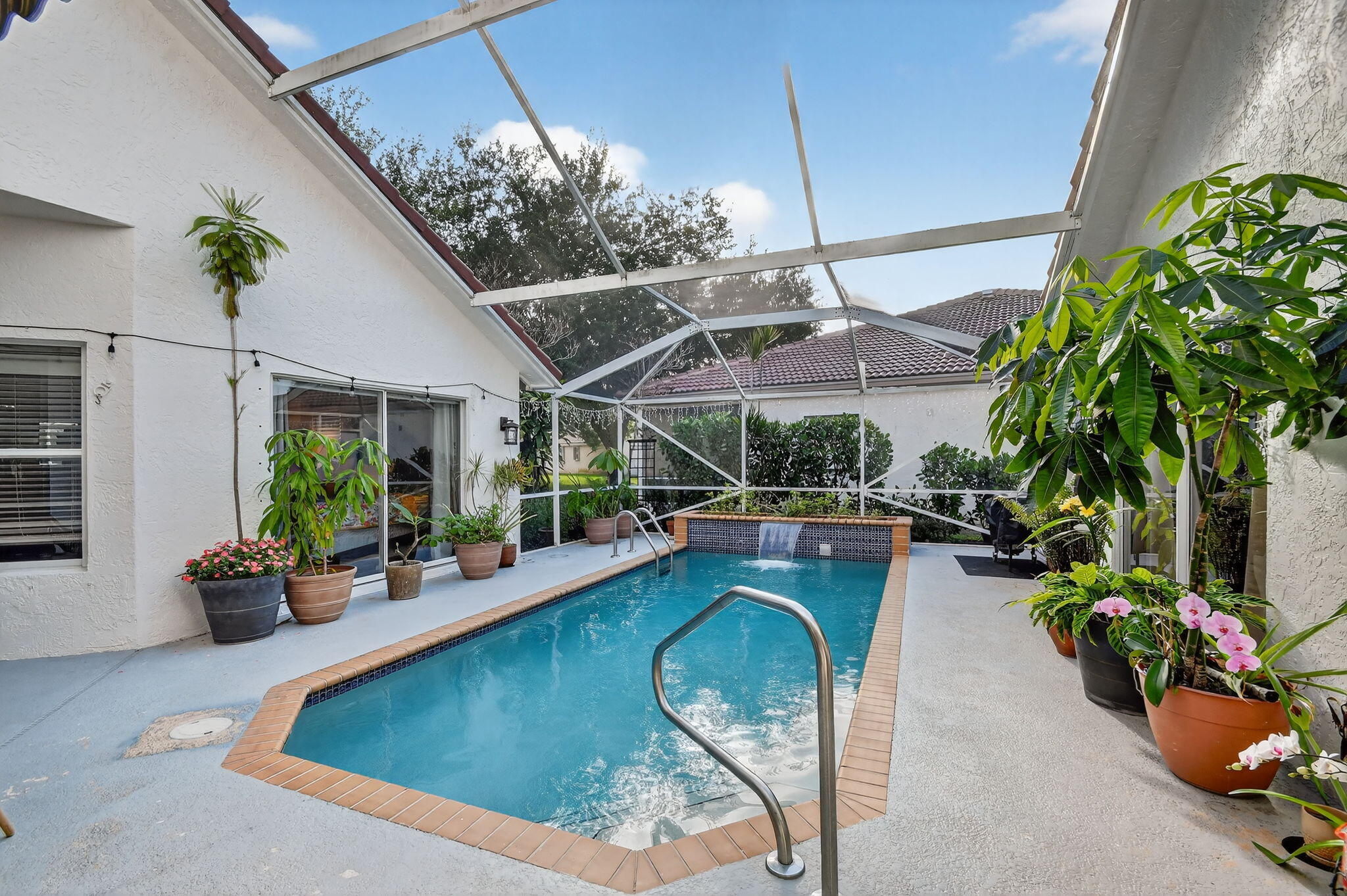 2769 Pointe Circle Greenacres, FL 33413 - Photo 5 of 48 a view of a swimming pool with a patio