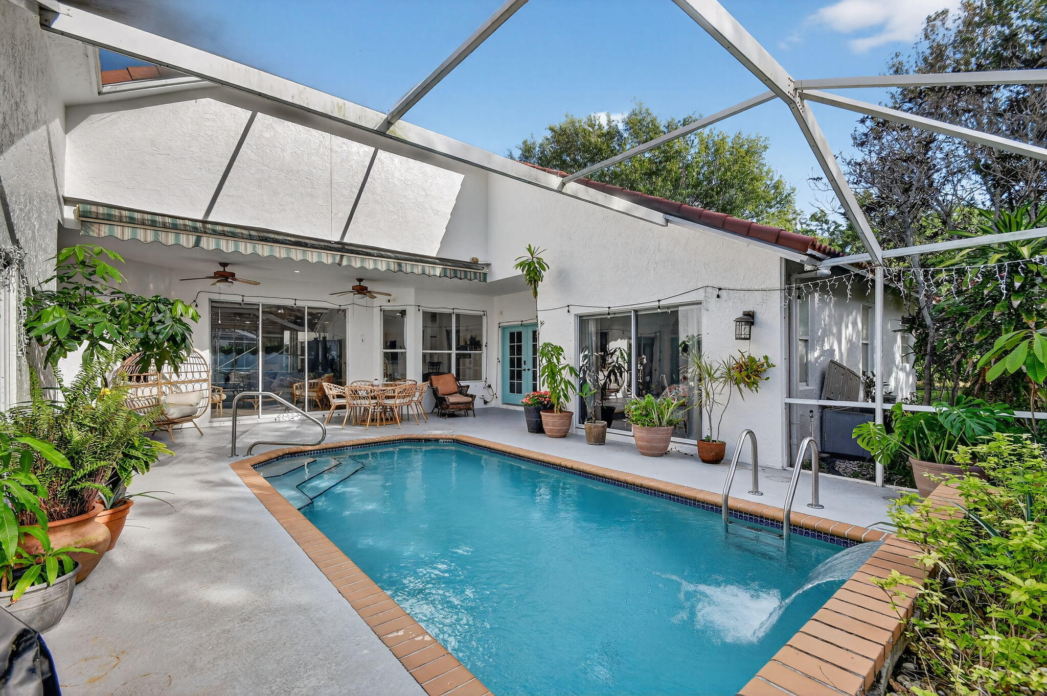 2769 Pointe Circle Greenacres, FL 33413 - Photo 7 of 48 a view of a swimming pool with a patio