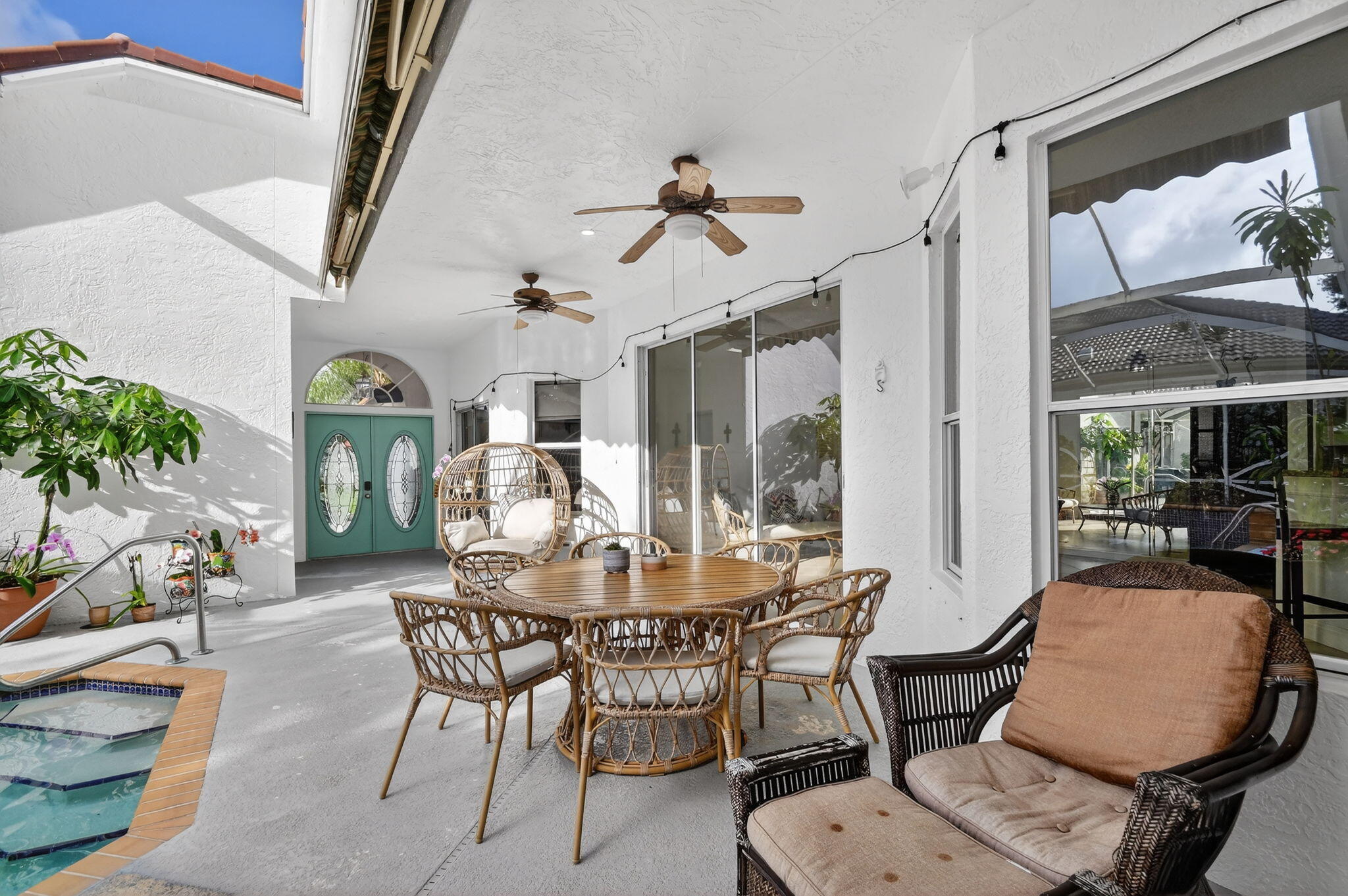 2769 Pointe Circle Greenacres, FL 33413 - Photo 8 of 48 a dining room with furniture a floor to ceiling window and wooden floor