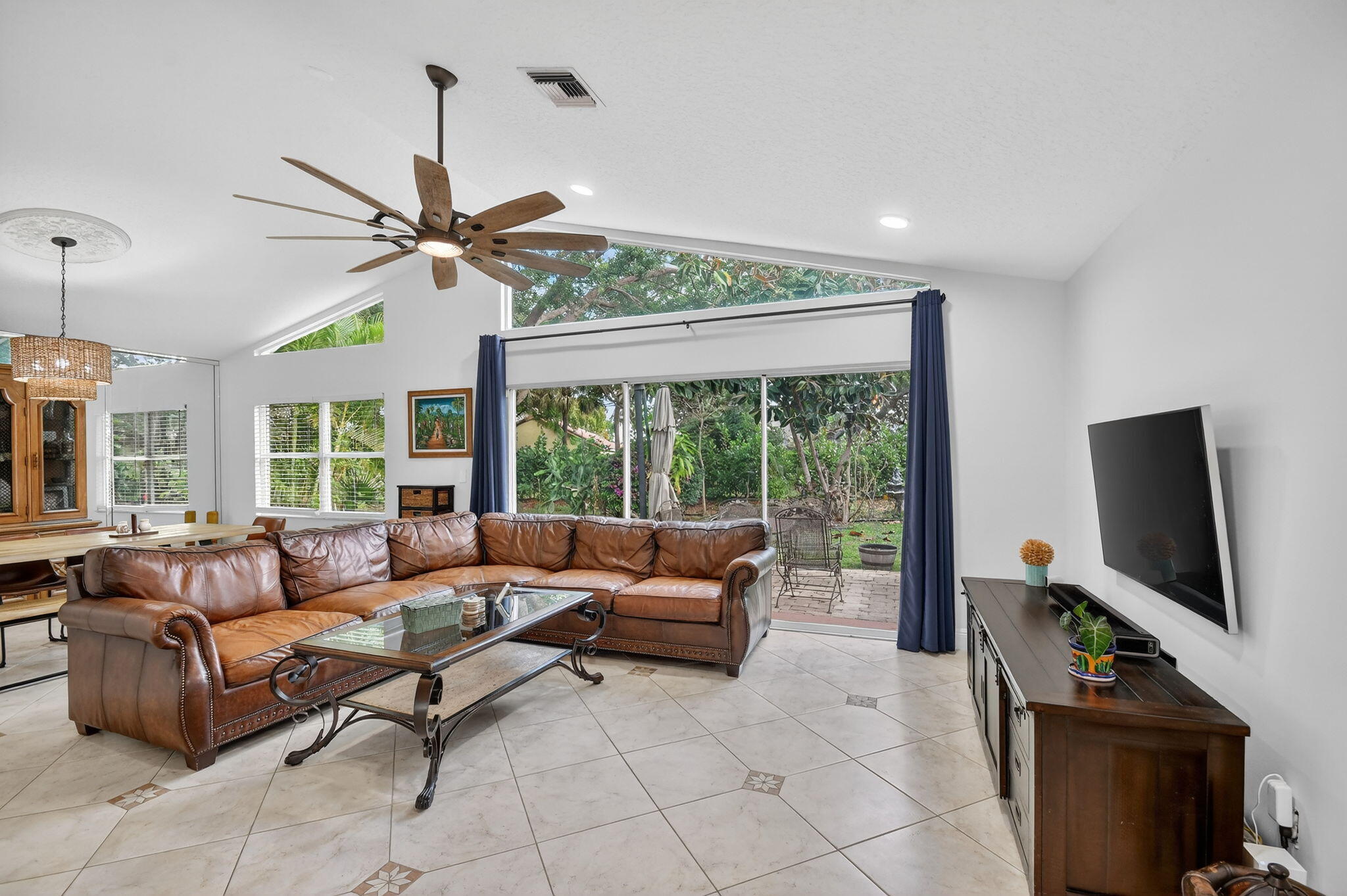 2769 Pointe Circle Greenacres, FL 33413 - Photo 9 of 48 a living room with furniture and a flat screen tv