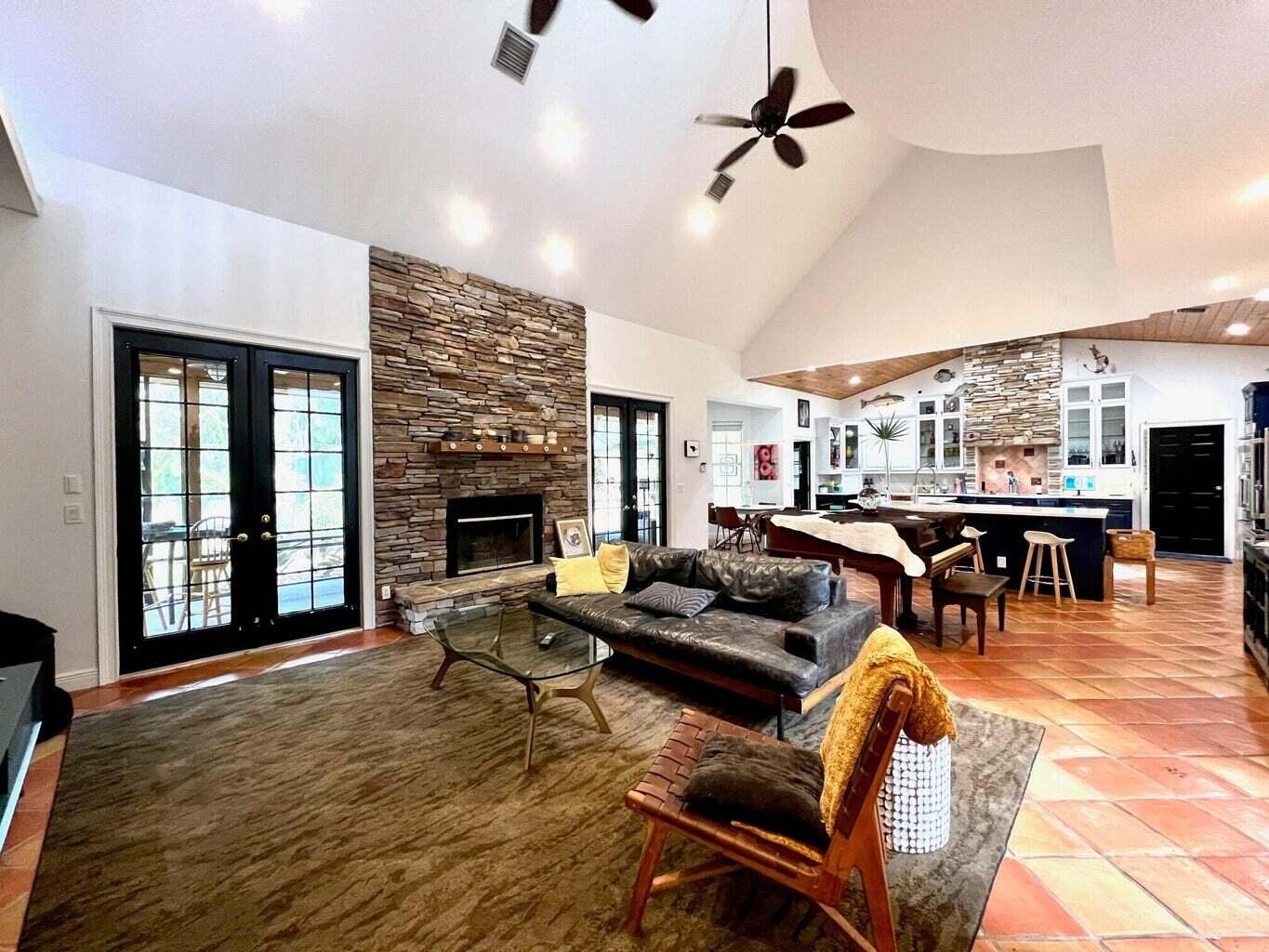 14425 North 64th Court North Loxahatchee, FL 33470 - Photo 12 of 36 a living room with furniture and a fireplace