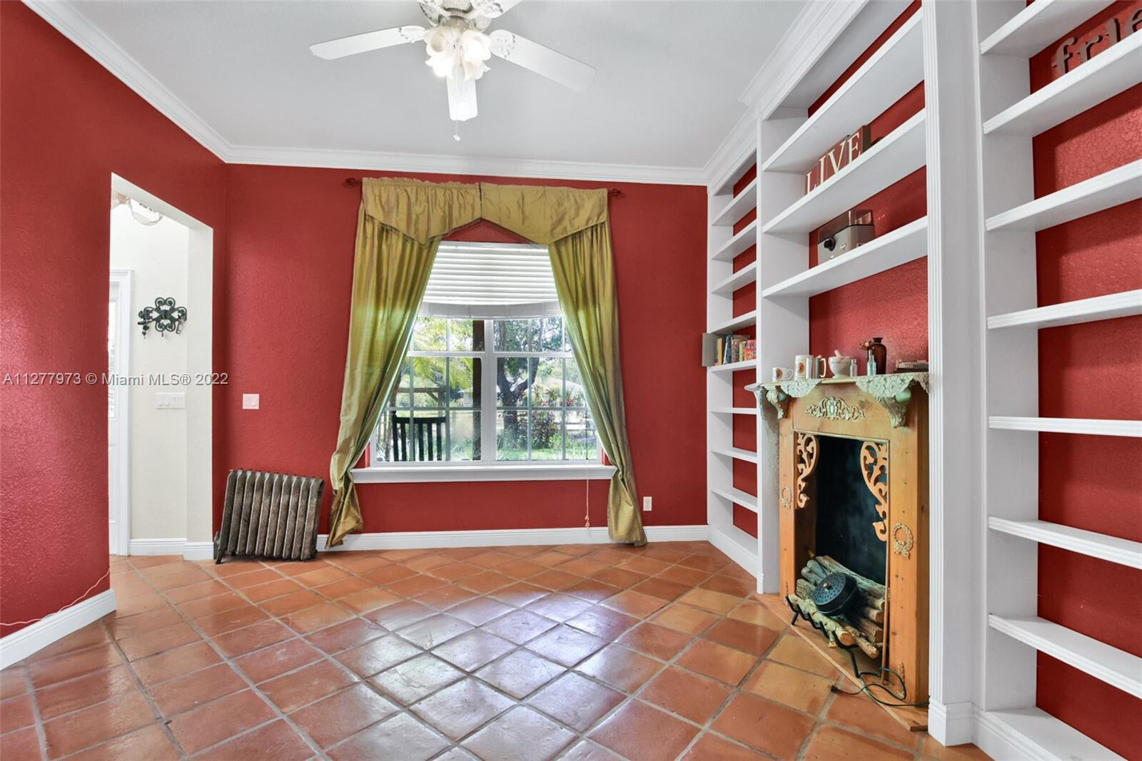 14425 North 64th Court North Loxahatchee, FL 33470 - Photo 23 of 36 a view of a living room with furniture and a fireplace