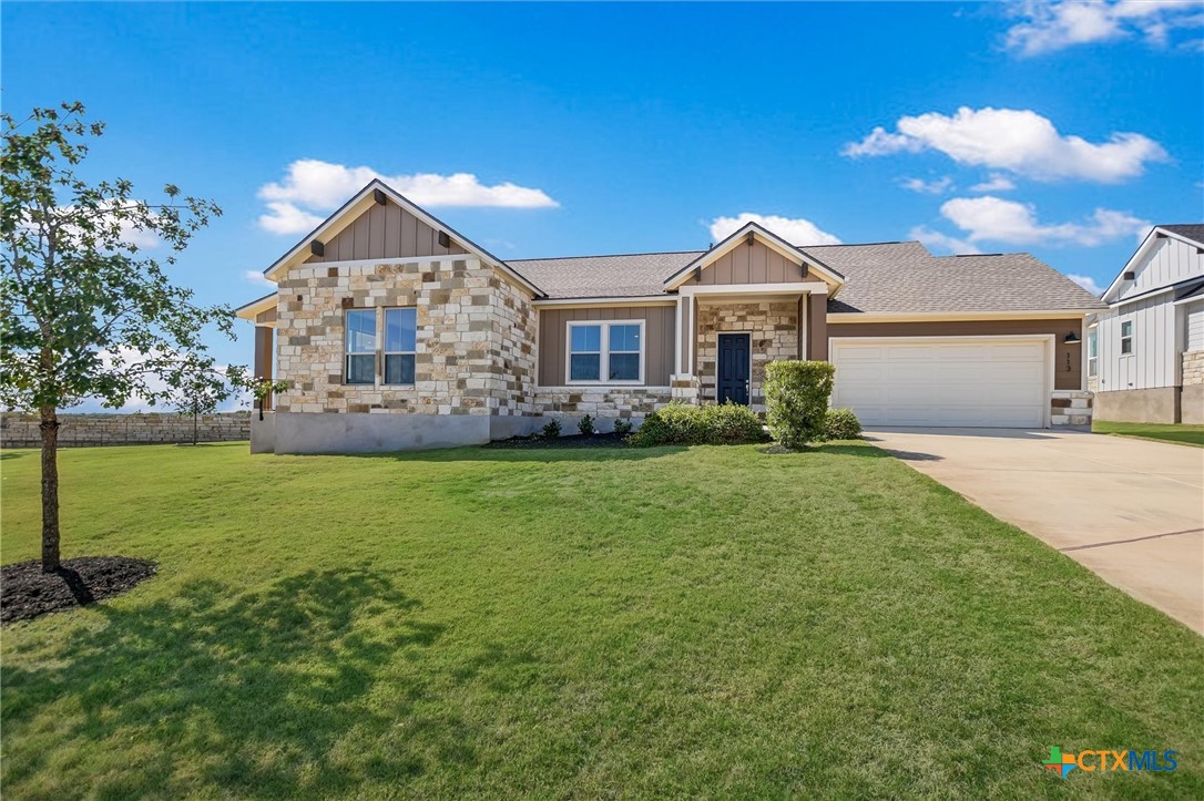 a front view of a house with garden