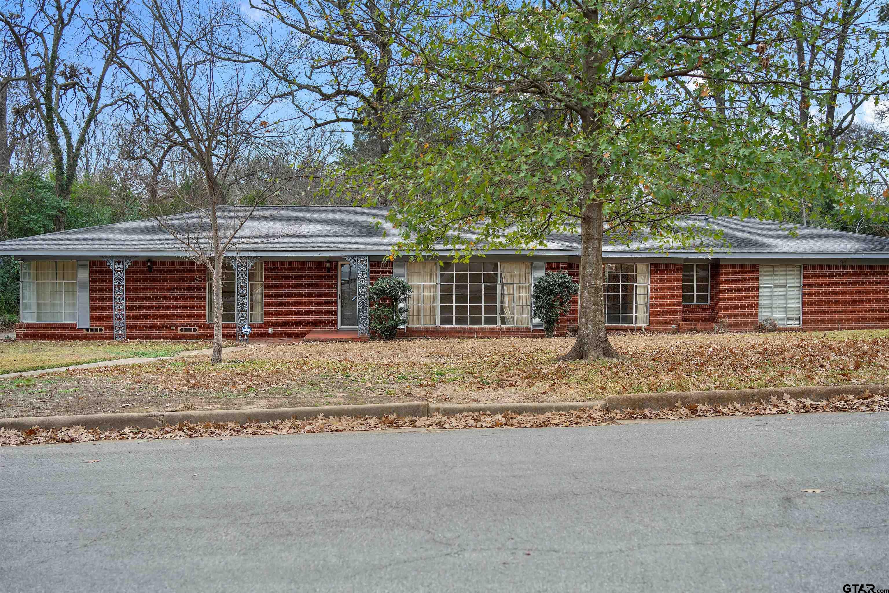 front view of a house with a yard