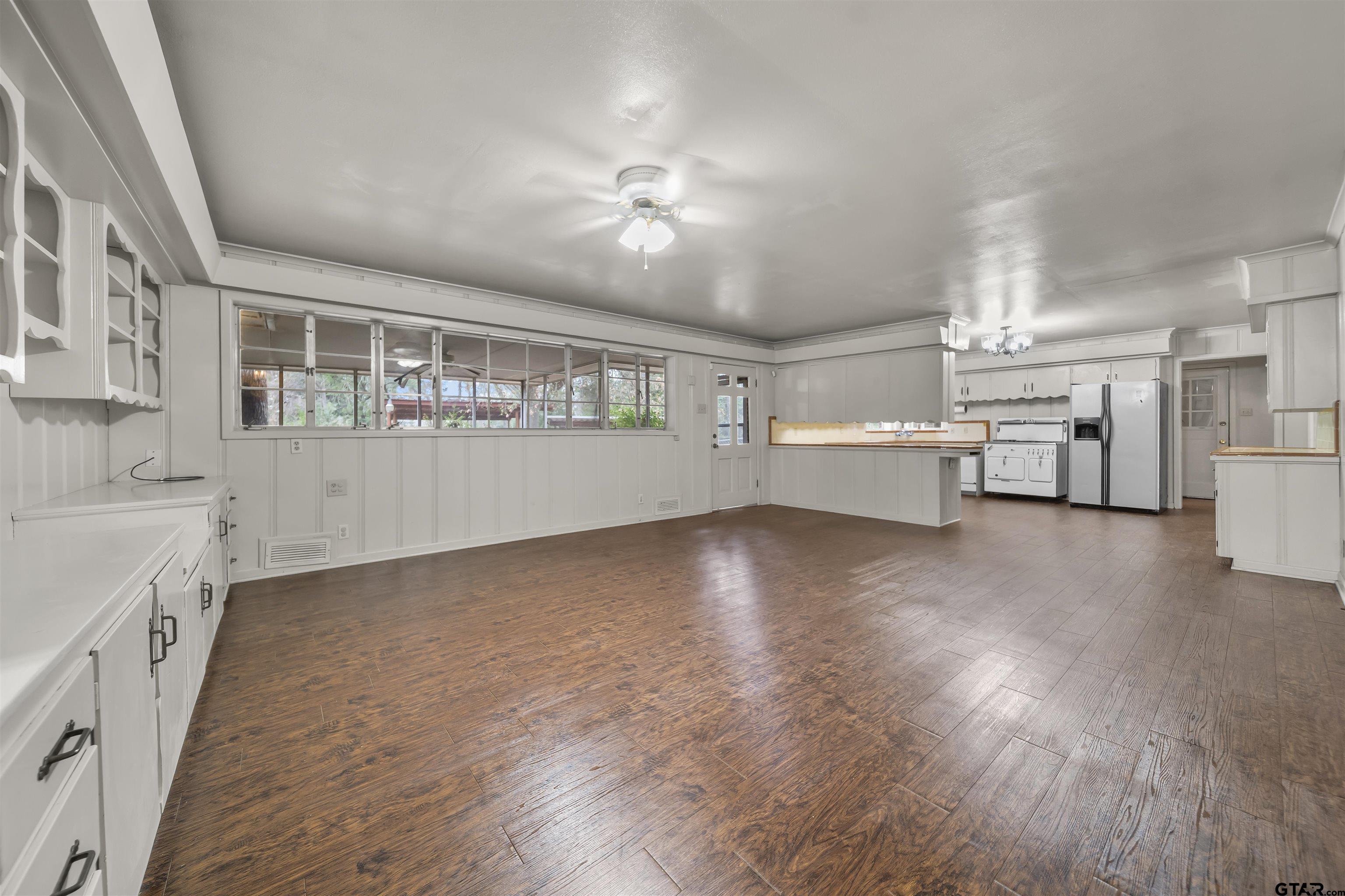 2521 Pounds Tyler, TX 75701 - Photo 12 of 40 a view of a kitchen with a sink and dishwasher cabinets with wooden floor