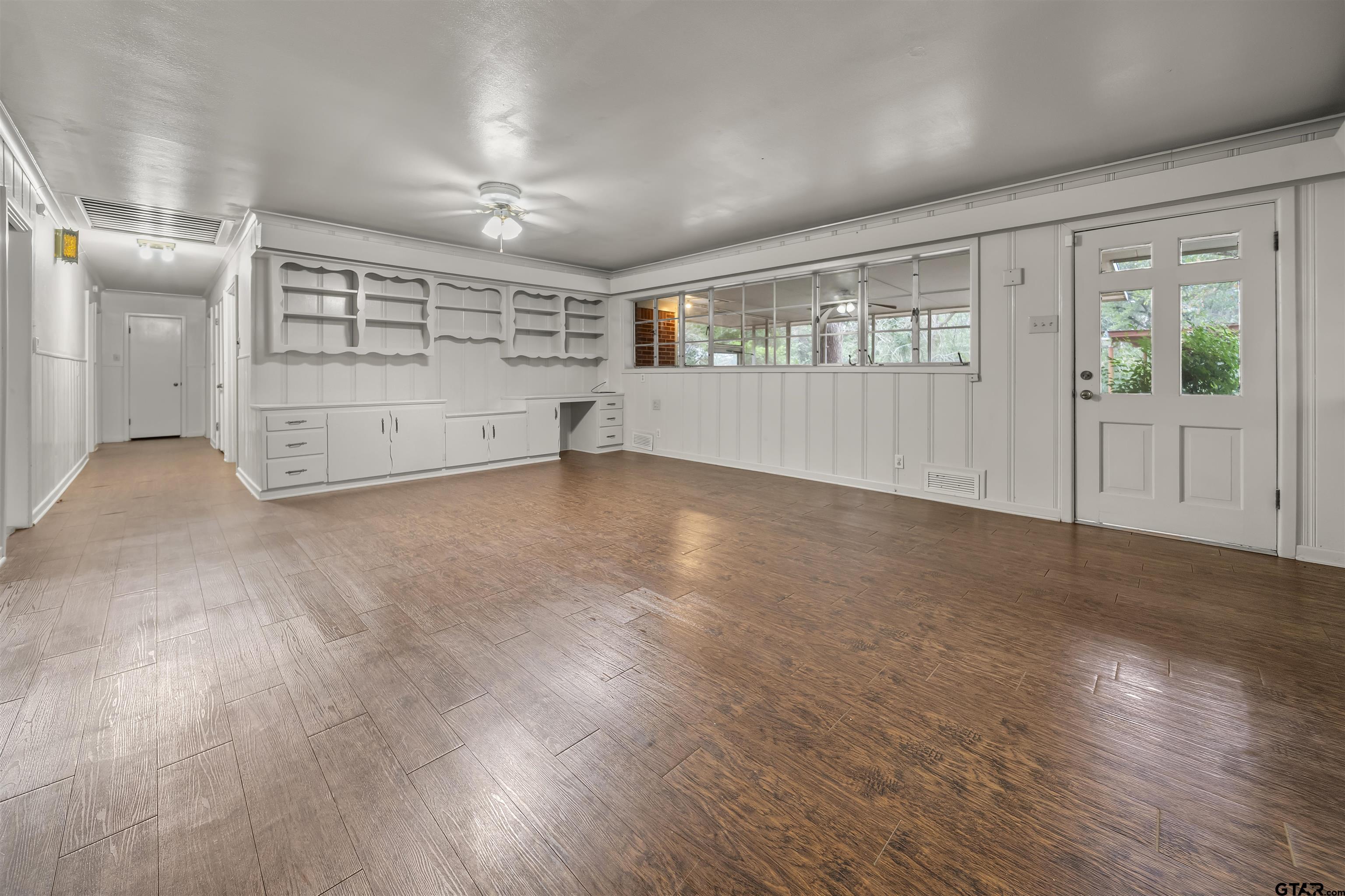 2521 Pounds Tyler, TX 75701 - Photo 13 of 40 a view of an empty room with wooden floor and windows