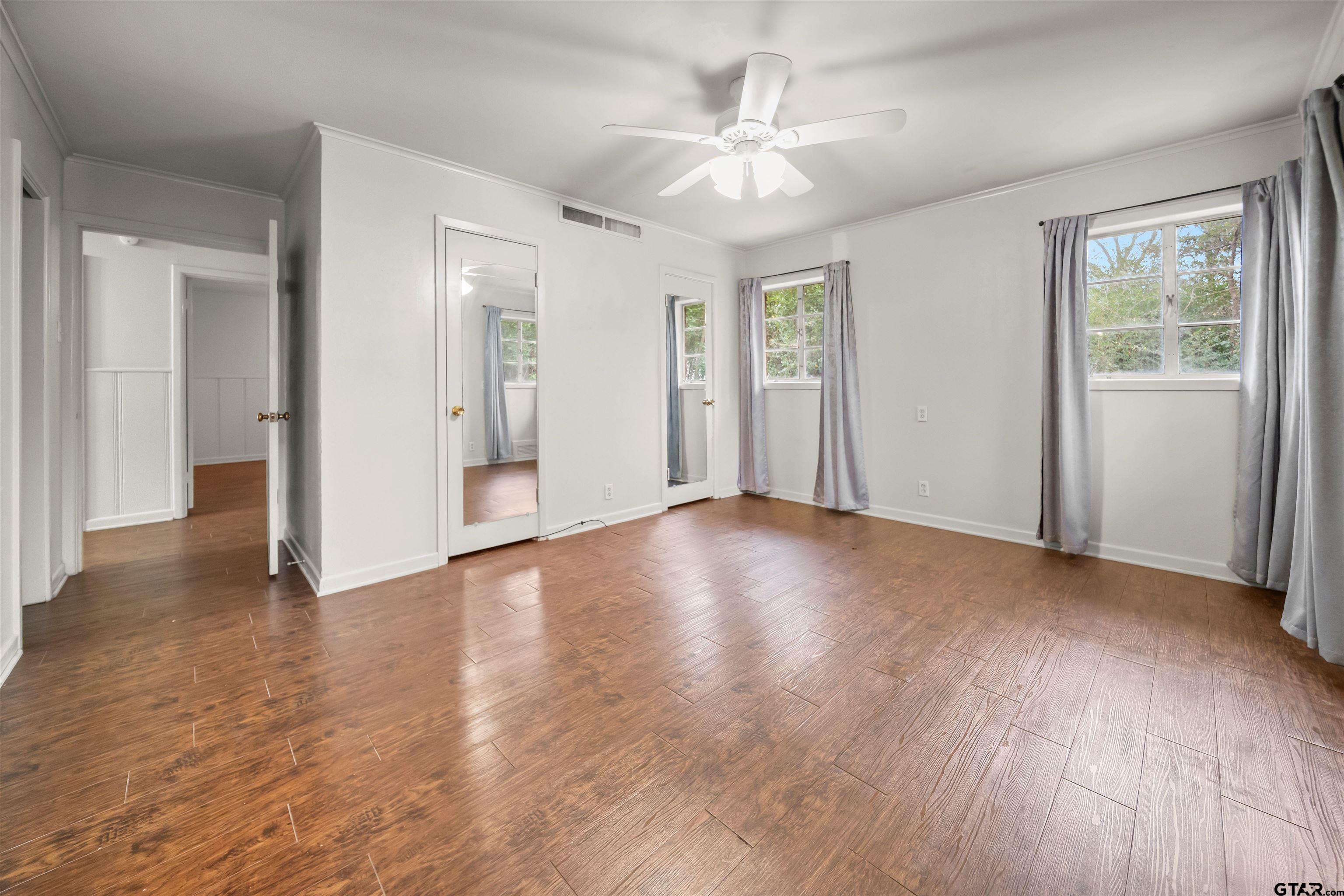2521 Pounds Tyler, TX 75701 - Photo 17 of 40 an empty room with wooden floor and windows