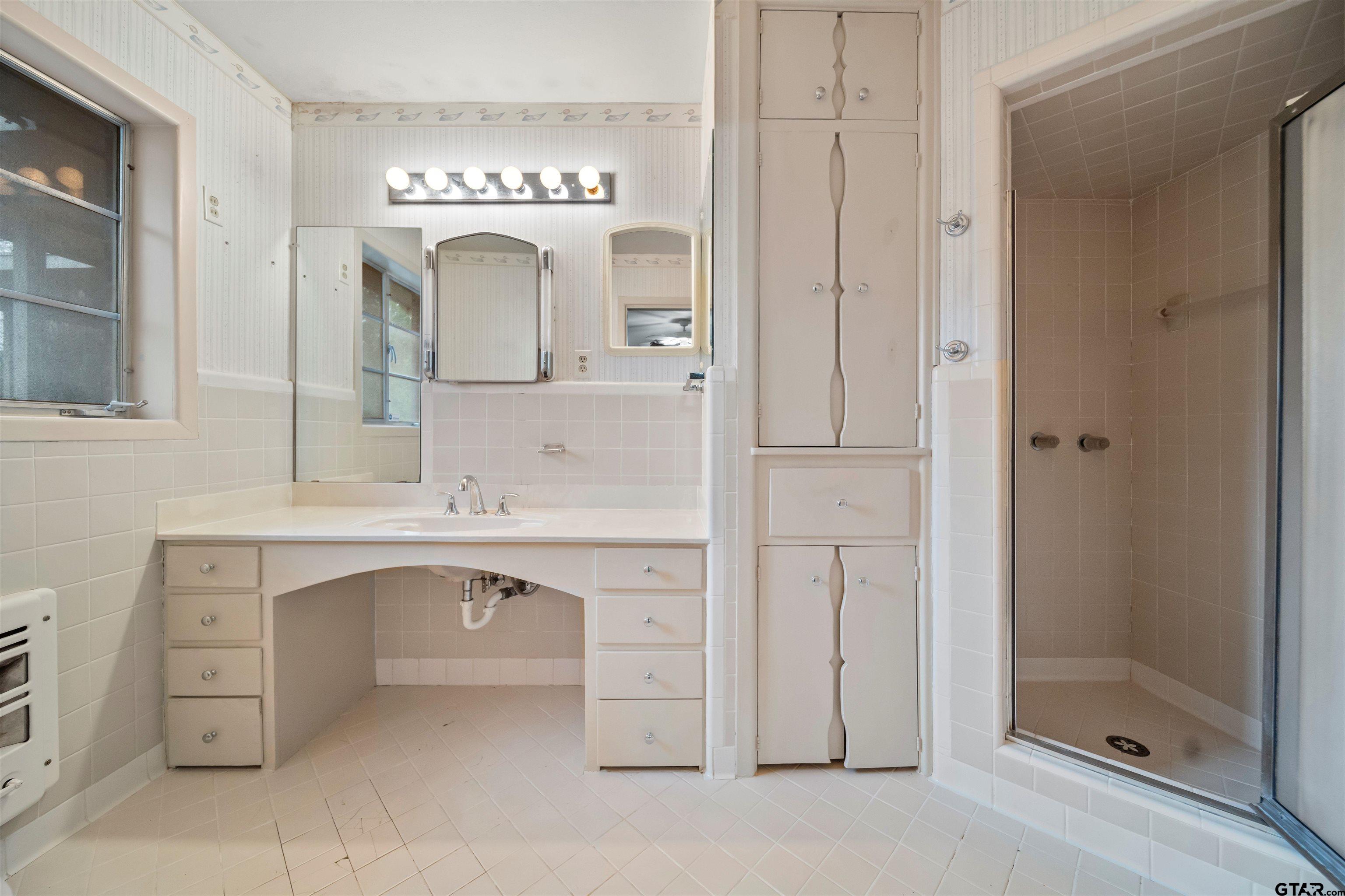 2521 Pounds Tyler, TX 75701 - Photo 19 of 40 a bathroom with a double vanity sink mirror and shower