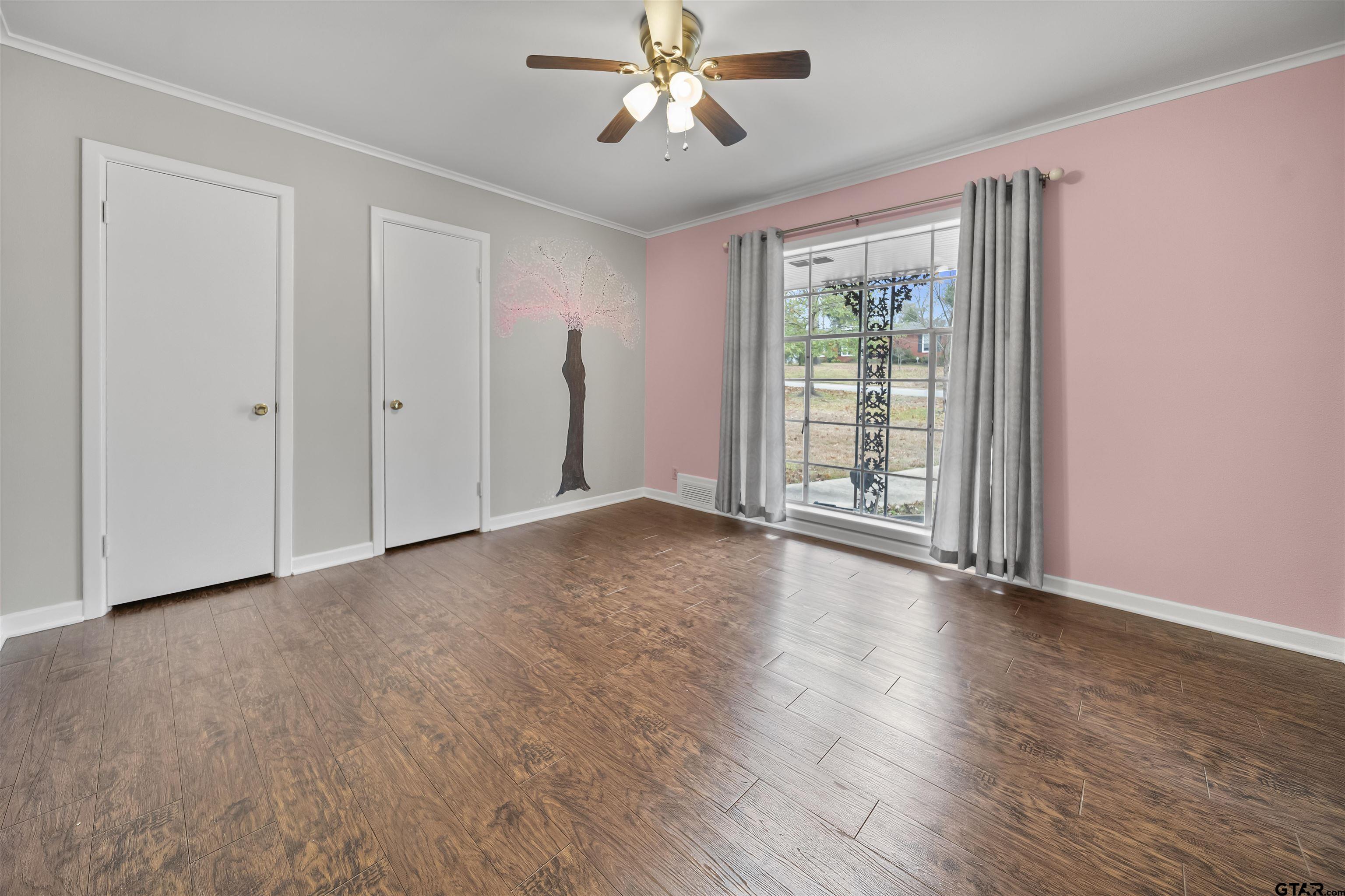 2521 Pounds Tyler, TX 75701 - Photo 21 of 40 a view of an empty room with wooden floor and a window