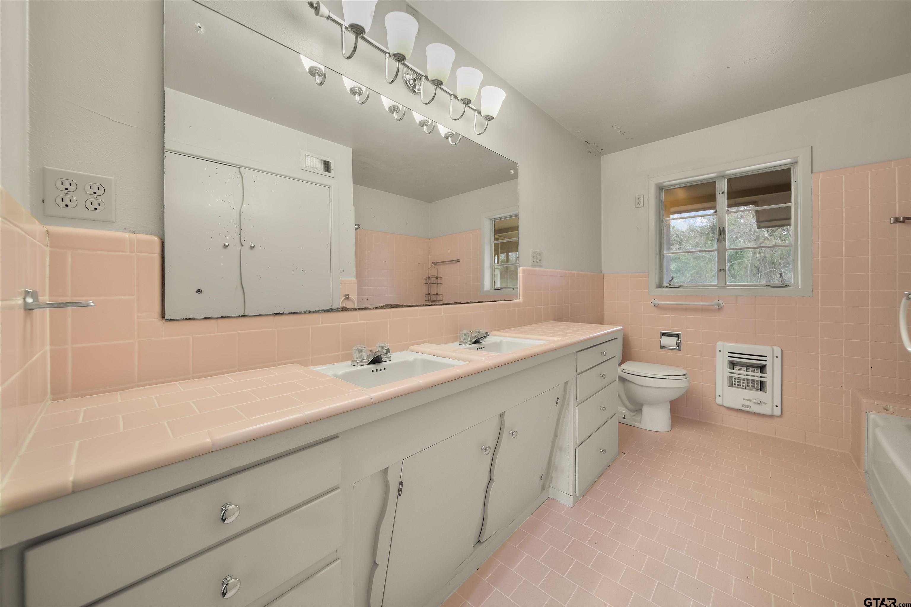 2521 Pounds Tyler, TX 75701 - Photo 24 of 40 a bathroom with a double vanity sink mirror and toilet