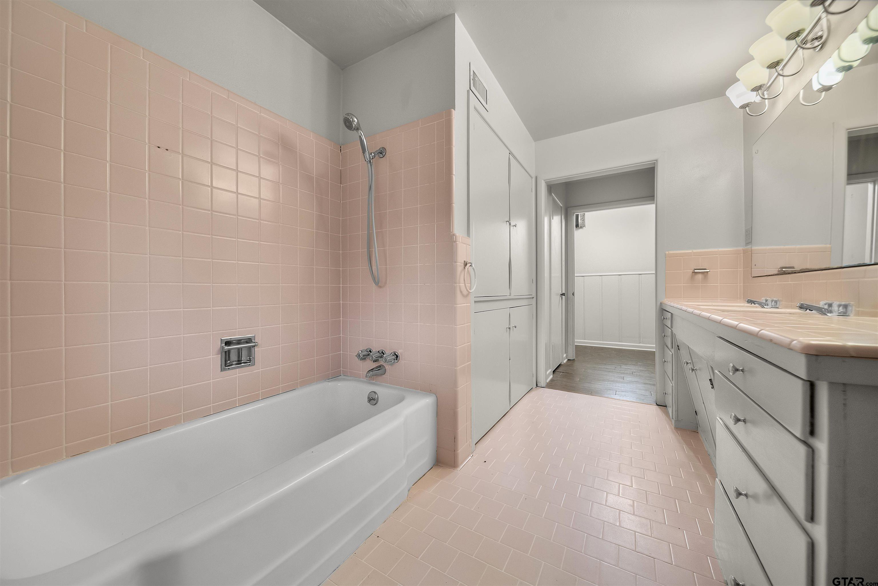 2521 Pounds Tyler, TX 75701 - Photo 25 of 40 a bathroom with a tub sink and mirror