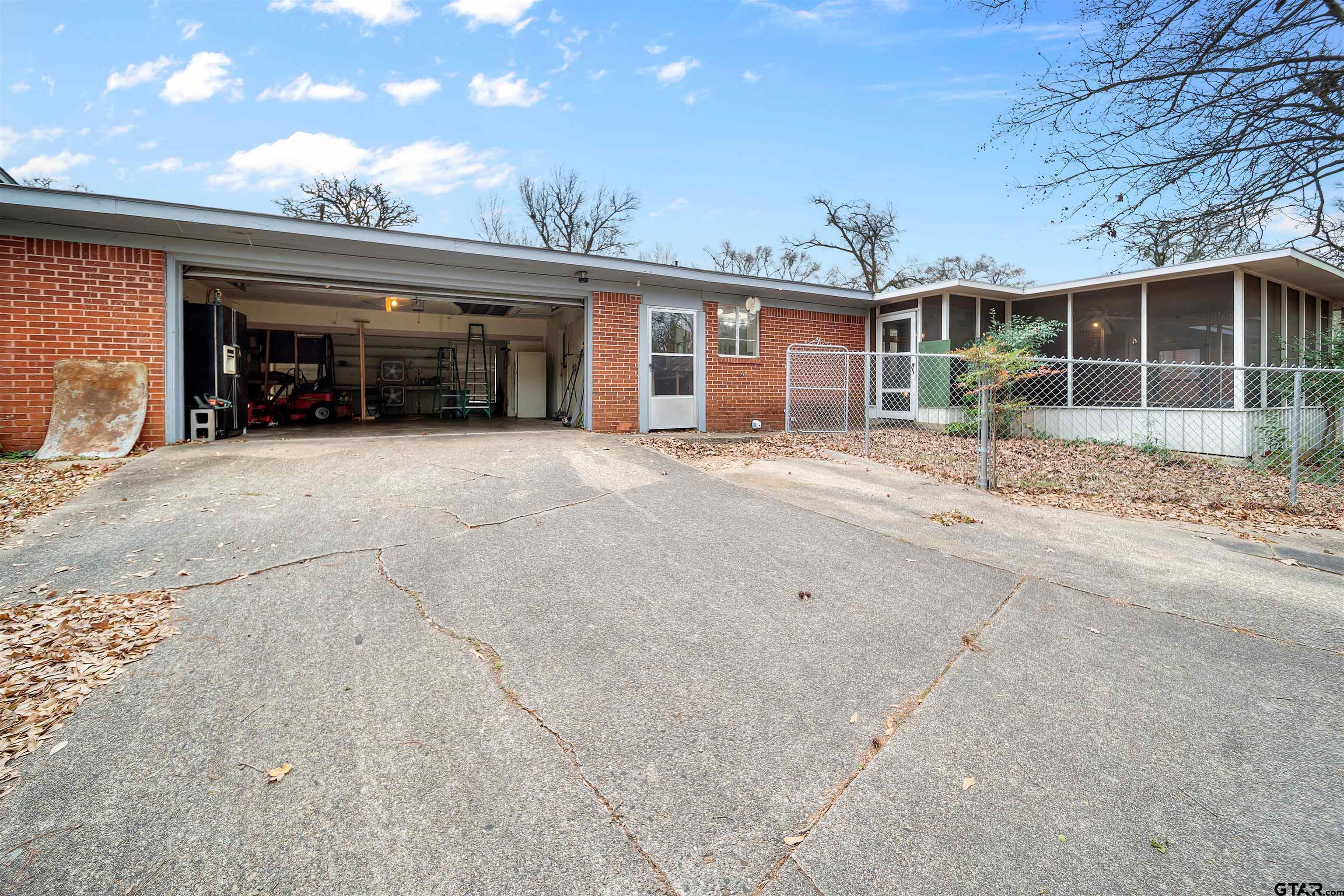 2521 Pounds Tyler, TX 75701 - Photo 33 of 40 front view of a house with a large window and potted plants