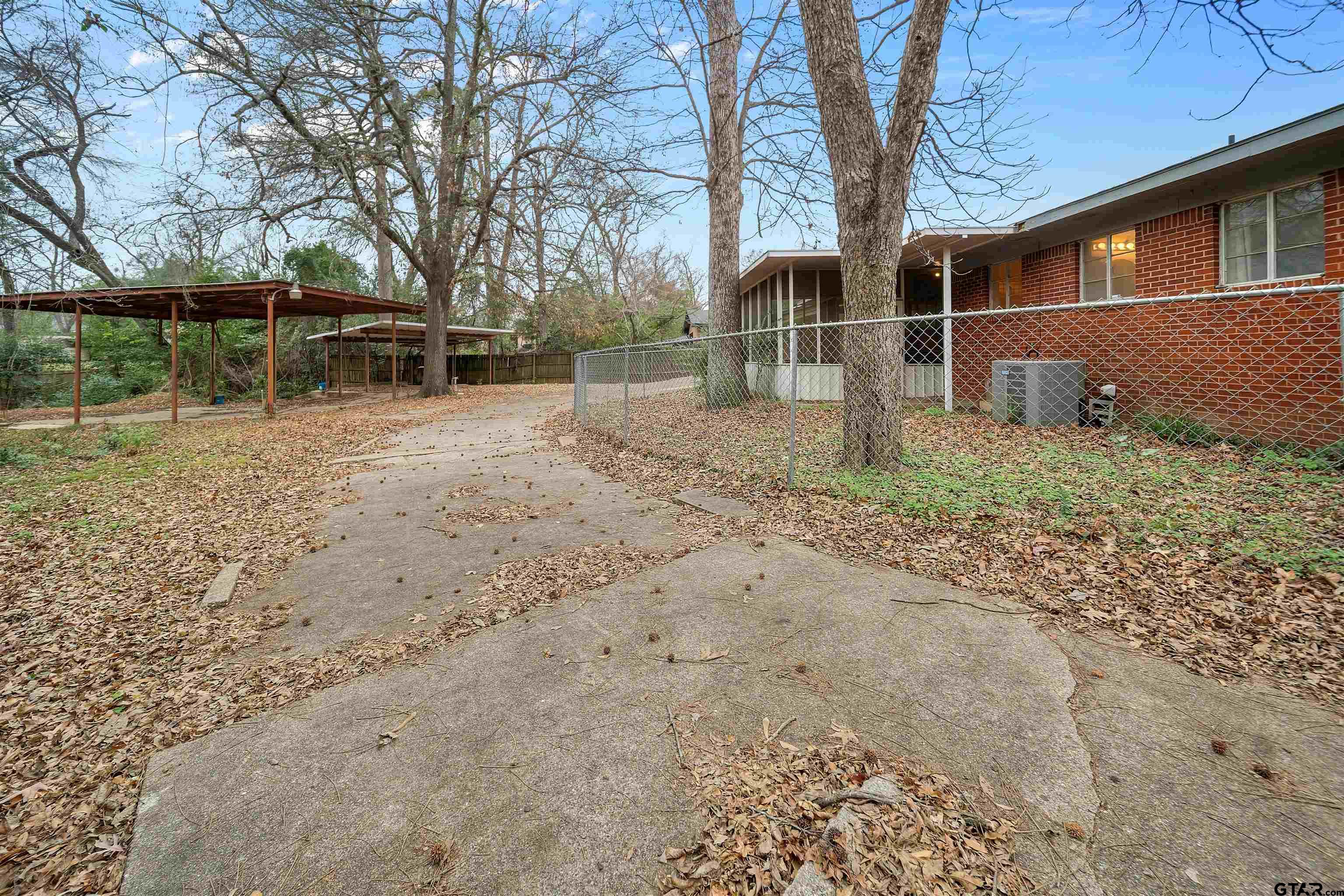 2521 Pounds Tyler, TX 75701 - Photo 37 of 40 a backyard of a house with lots of green space