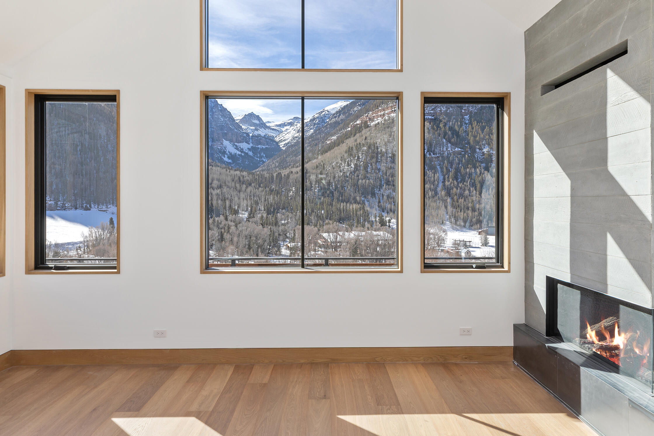 764 Primrose Lane Telluride, CO 81435 - Photo 2 of 23 a view of an empty room with wooden floor and a window