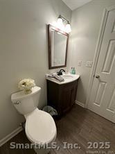324 Capitol Avenue Waterbury, CT 06705 - Photo 11 of 32 a bathroom with a toilet sink and mirror