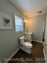 324 Capitol Avenue Waterbury, CT 06705 - Photo 18 of 32 a bathroom with a toilet a sink and a window