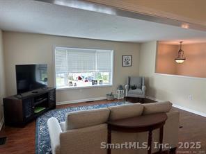 324 Capitol Avenue Waterbury, CT 06705 - Photo 29 of 32 a living room with furniture and a flat screen tv
