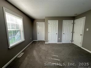 324 Capitol Avenue Waterbury, CT 06705 - Photo 6 of 32 an empty room with windows
