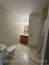 324 Capitol Avenue Waterbury, CT 06705 - Photo 7 of 32 a bathroom with a sink a toilet a mirror and shower