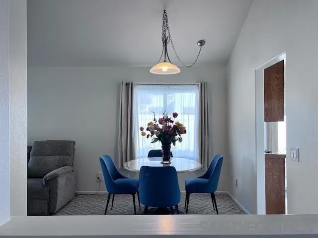 a kitchen with cabinets appliances a sink and a counter top space