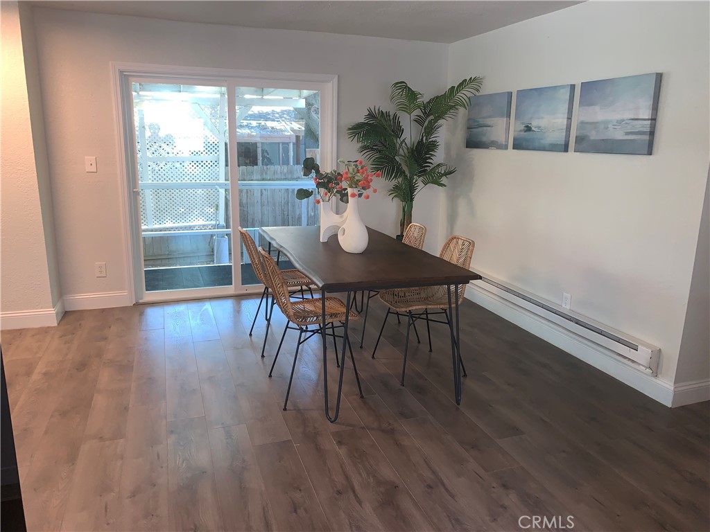 11092 East Highway 20 Lucerne, CA 95423 - Photo 11 of 27 a view of a dining room with furniture and wooden floor