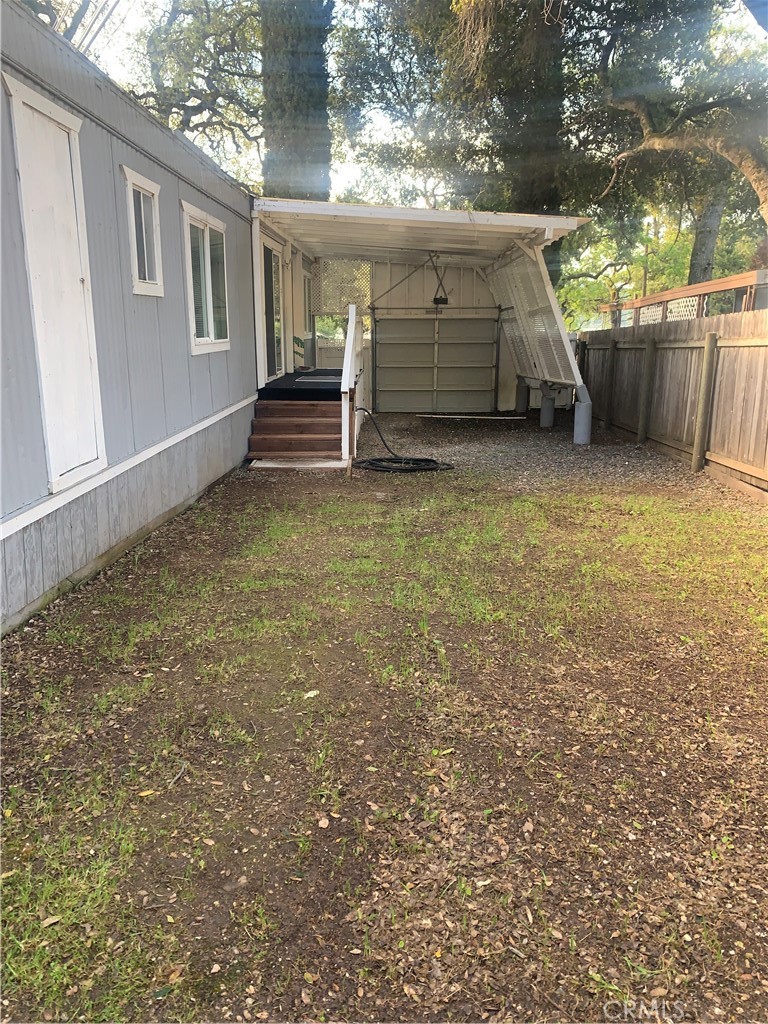 11092 East Highway 20 Lucerne, CA 95423 - Photo 24 of 27 a view of a house with a back yard