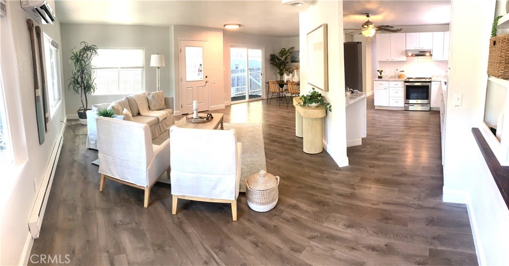 11092 East Highway 20 Lucerne, CA 95423 - Photo 3 of 27 a living room with furniture a wooden floor and a large window