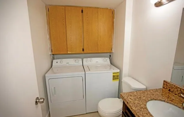 a bathroom with a sink and toilet