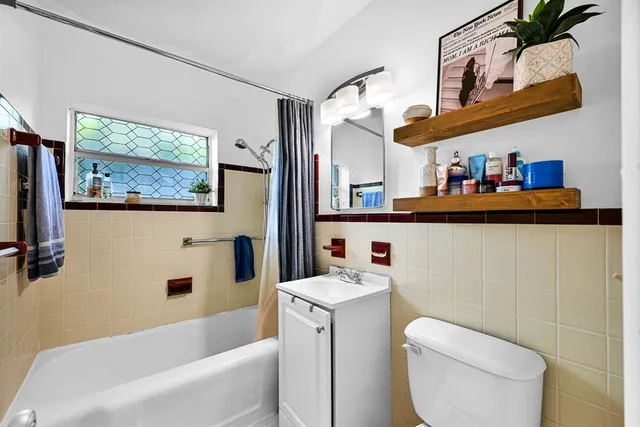 a bathroom with a sink a toilet and a bathtub