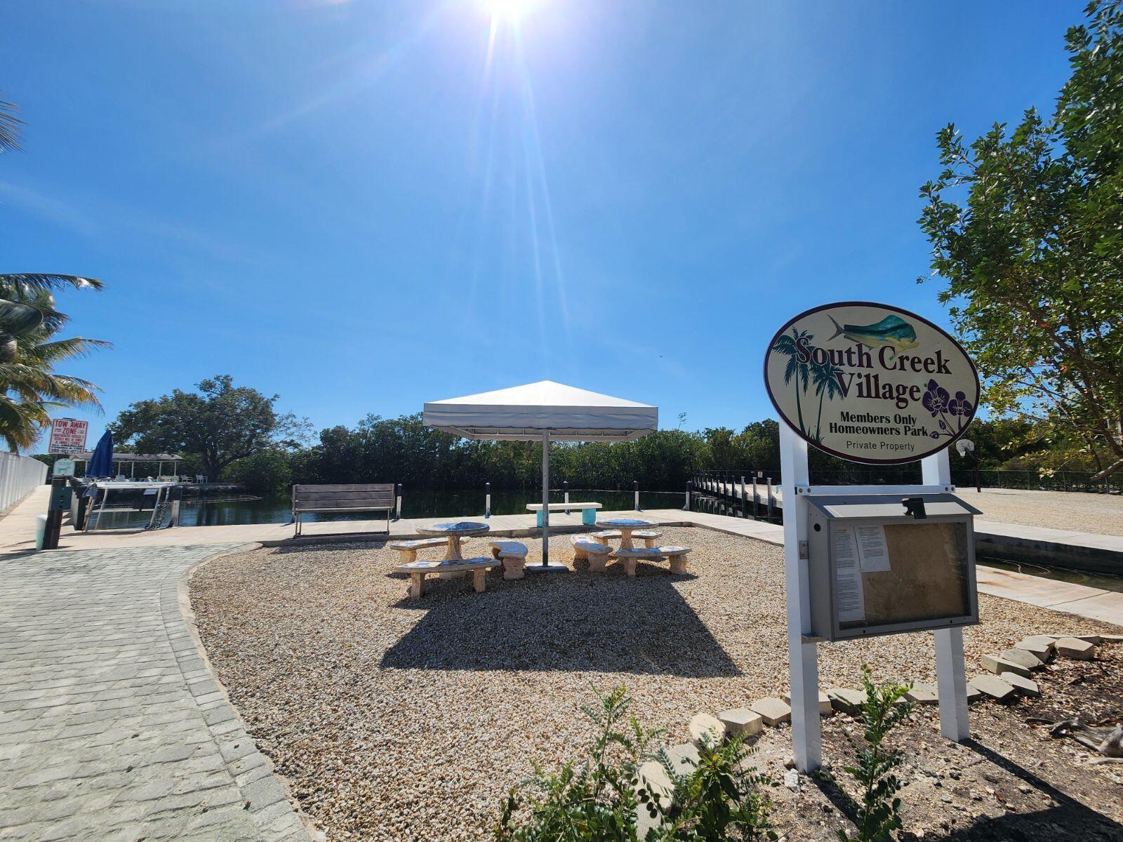 338 Sound Drive Key Largo, FL 33037 - Photo 12 of 13 a swimming pool with outdoor seating and yard