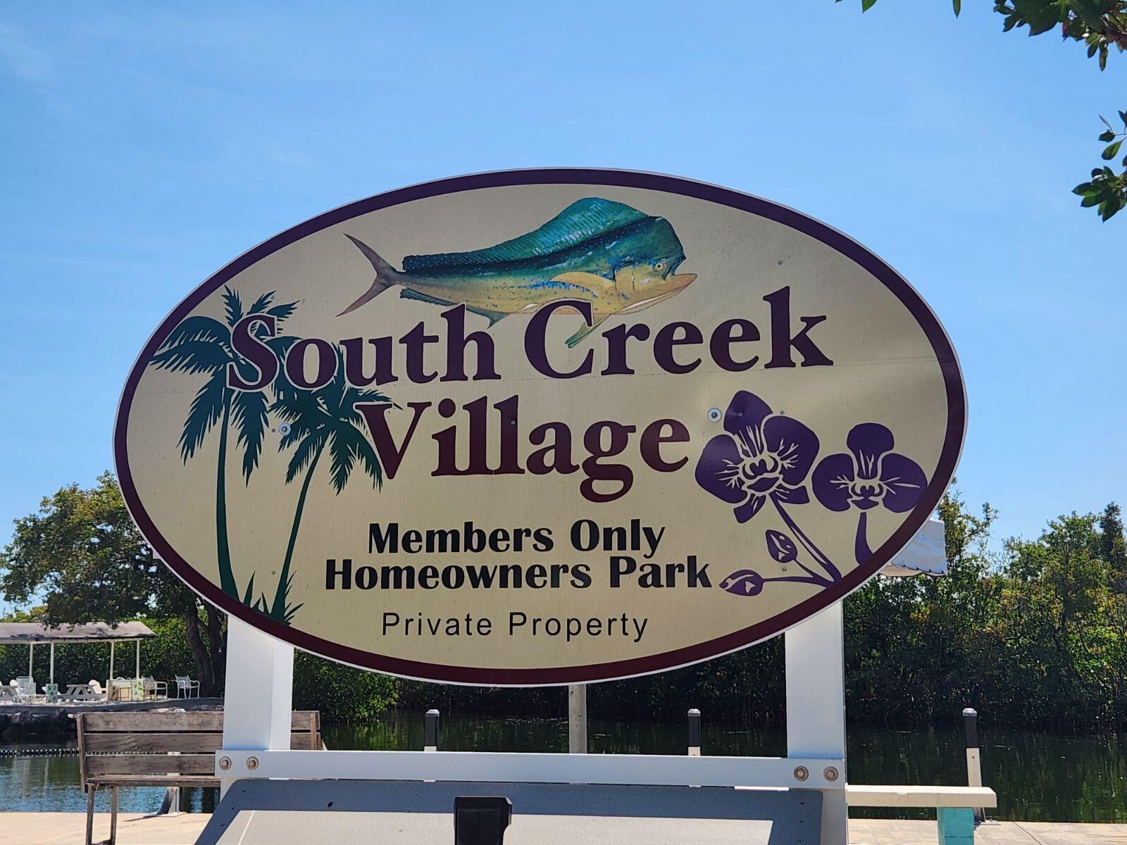 338 Sound Drive Key Largo, FL 33037 - Photo 10 of 13 a sign on a pole on a street