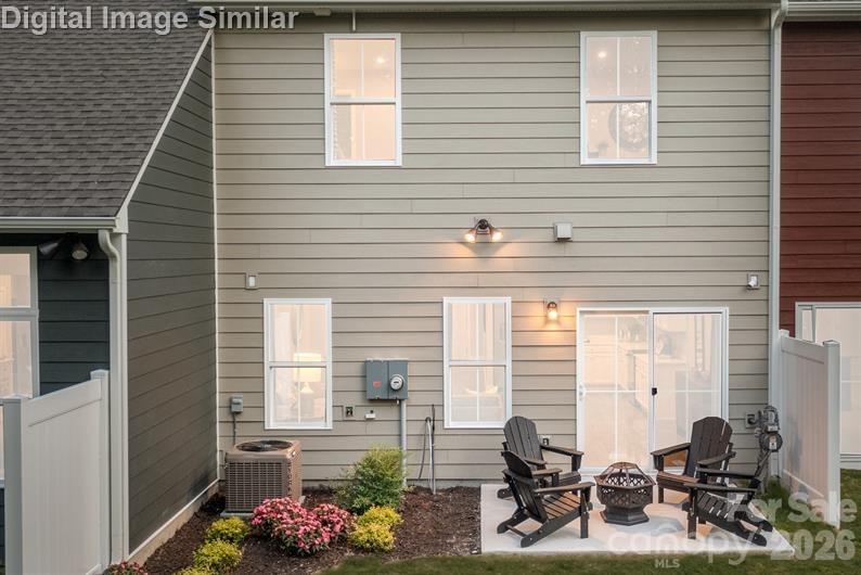 9546 Teamwork Street Northwest Concord, NC 28027 - Photo 16 of 23 a view of backyard with sitting area
