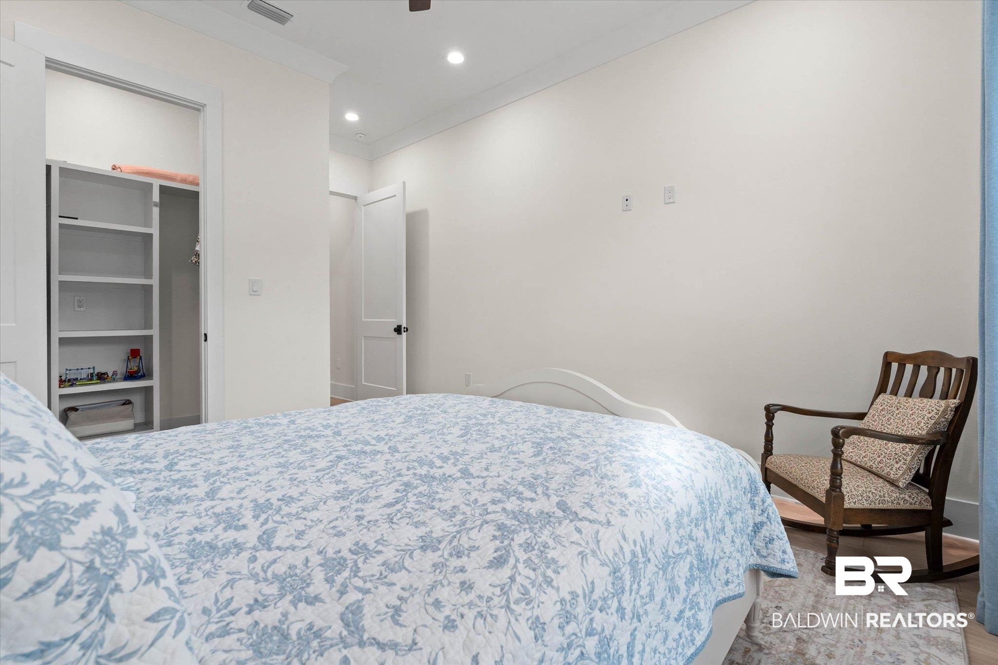 11 Creax Road Axis, AL 36505 - Photo 21 of 46 Interior room featuring recessed lighting, crown molding, a built-in closet system with shelving, and white paneled doors with black hardware