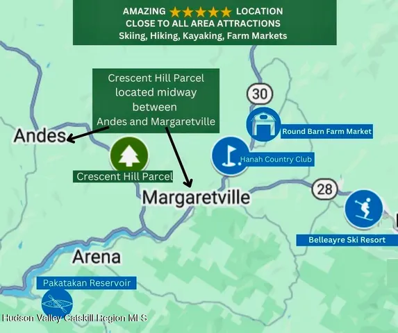 a view of a town with mountains in the background