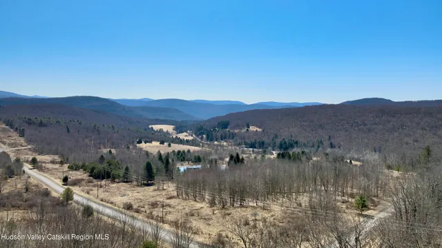 a view of a bunch of trees and a building in background