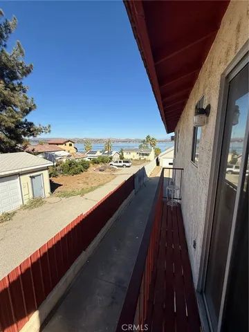 a view of a balcony with an outdoor seating