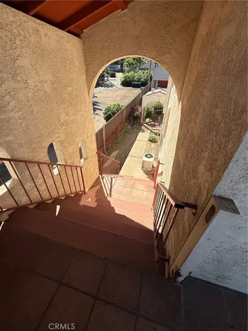 a roof deck with a table and chairs