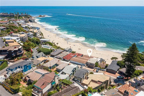 an aerial view of residential house with beach