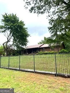 a view of a garden with a small pool
