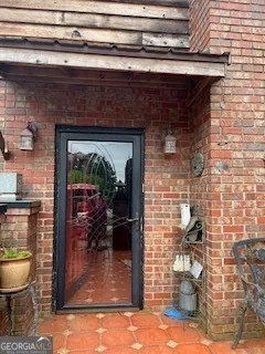 a dining room with table and chairs