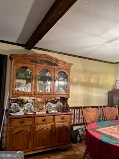 a living room with lots of furniture and clutter