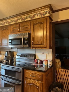 376 Paoli Road Carlton, GA 30627 - Photo 22 of 51 a kitchen with stainless steel appliances granite countertop a sink and cabinets