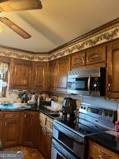 376 Paoli Road Carlton, GA 30627 - Photo 23 of 51 a kitchen with a sink and cabinets