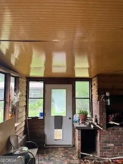 a bed sitting in a bedroom next to a window